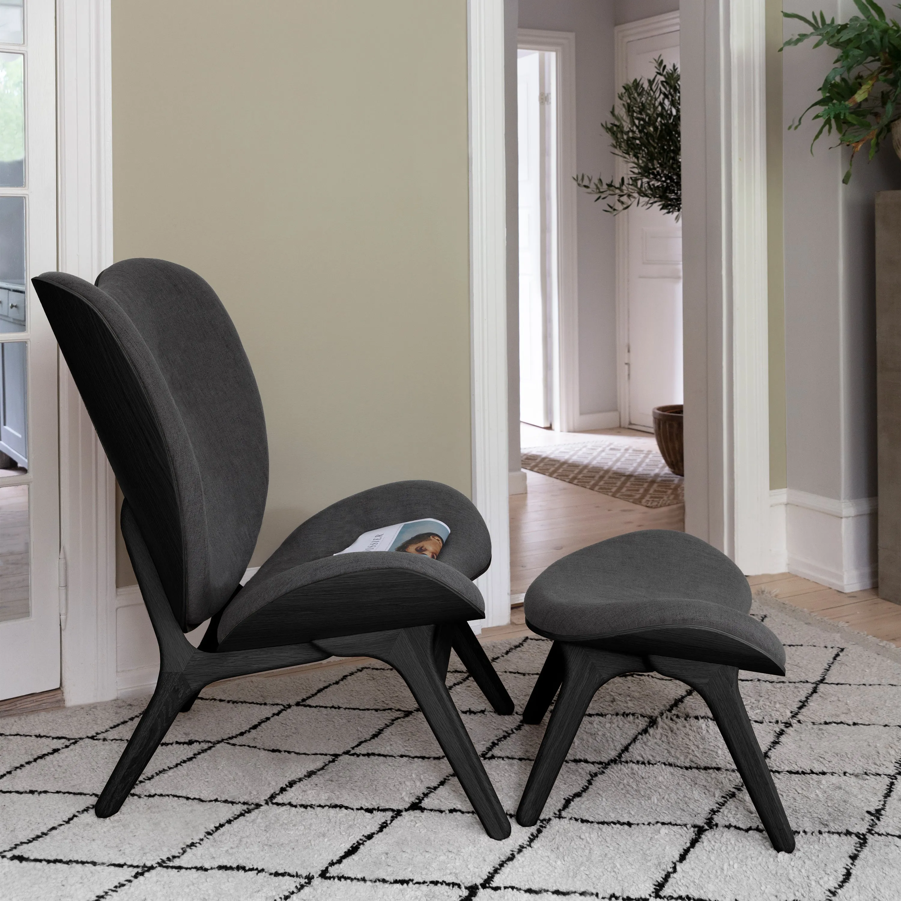 A Conversation Piece Tall Lounge Chair